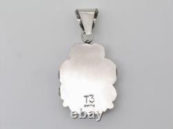 Pendentif fait main en argent sterling et turquoise par la Navajo Tia Long