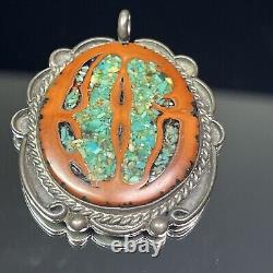 Pendentif ovale en argent sterling natif américain Navajo avec incrustation de turquoise et de noyer