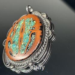 Pendentif ovale en argent sterling natif américain Navajo avec incrustation de turquoise et de noyer