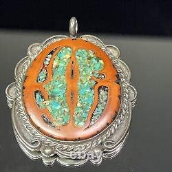 Pendentif ovale en argent sterling natif américain Navajo avec incrustation de turquoise et de noyer