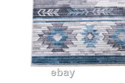 Tapis tribal moderne inspiré des Navajos du sud-ouest, motif décoloré.